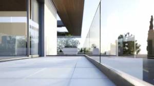 Blog 6 Base Shoe anchoring frameless glass railing on a modern balcony.